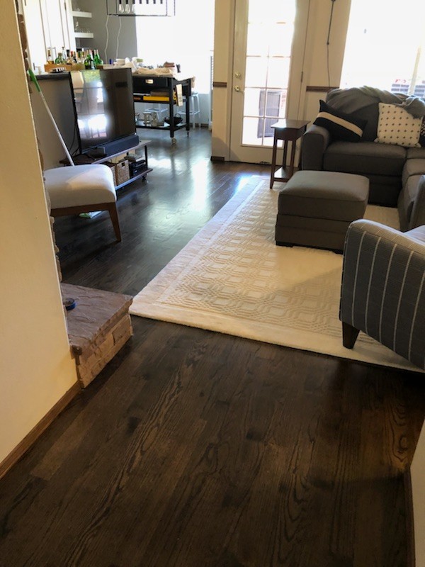Living room - transitional dark wood floor and brown floor living room idea in Phoenix with a tv stand