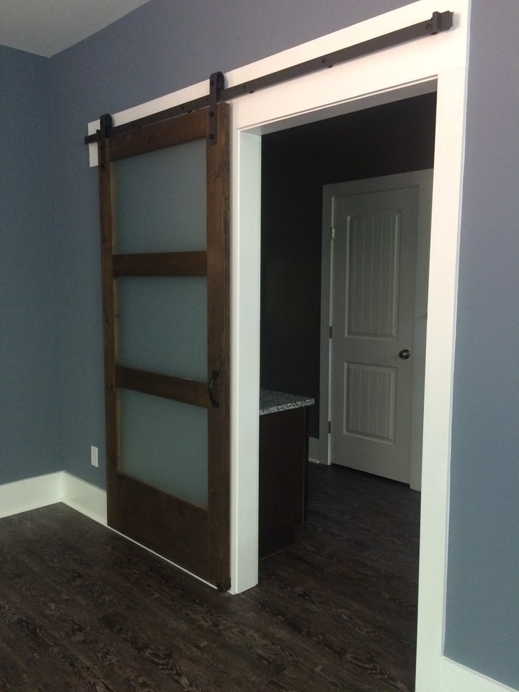 Example of a mid-sized transitional master dark wood floor hallway design with blue walls