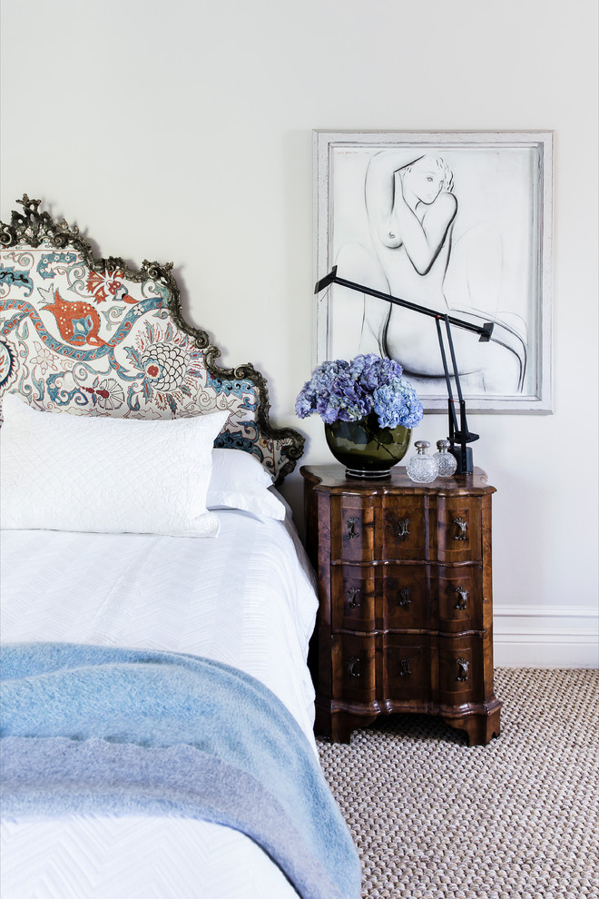 This is an example of a mid-sized traditional master bedroom in Sydney with beige walls, carpet and beige floor.