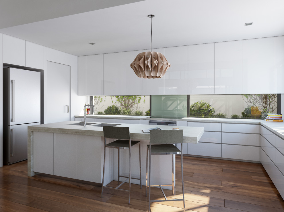 Inspiration for a large contemporary l-shaped eat-in kitchen in Melbourne with an undermount sink, flat-panel cabinets, white cabinets, quartz benchtops, glass sheet splashback, stainless steel appliances, medium hardwood floors and with island.