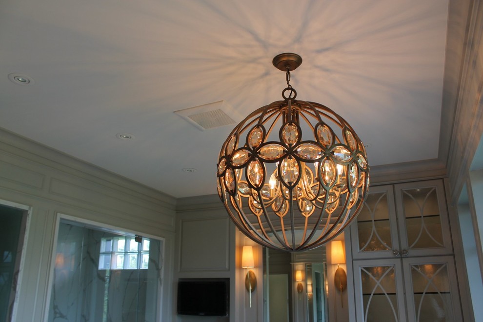 Example of a transitional home design design in Calgary