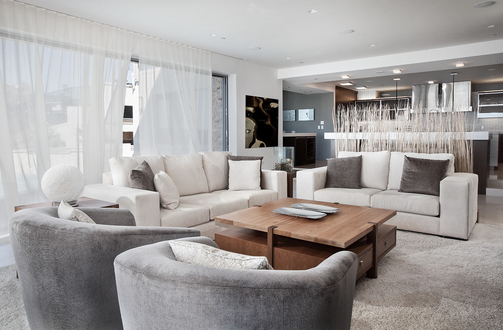 Photo of a contemporary open concept family room in Los Angeles with white walls.