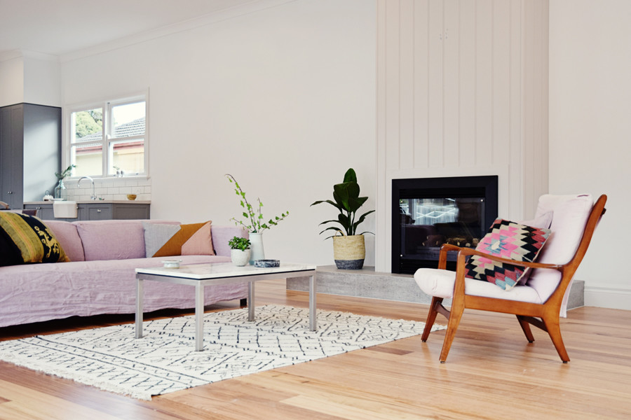 Photo of a large scandinavian open concept living room in Melbourne with white walls, light hardwood floors, a standard fireplace and a tile fireplace surround.