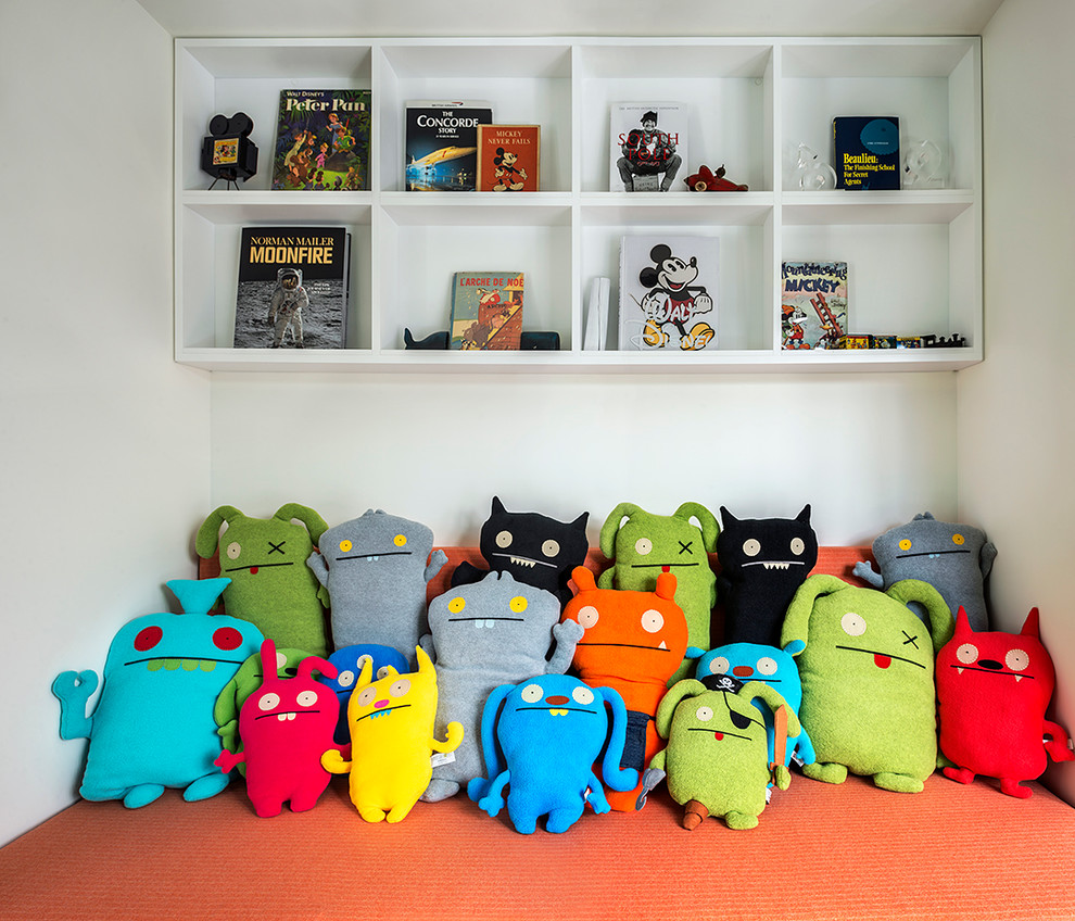 Inspiration for a small contemporary kids' playroom for kids 4-10 years old and boys in New York with white walls.
