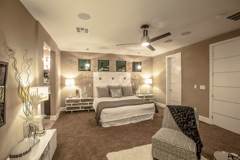 This is an example of a mid-sized eclectic guest bedroom in Las Vegas with beige walls, carpet and no fireplace.