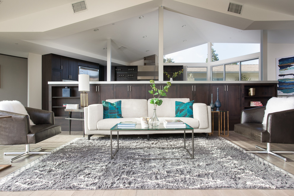 Photo of a contemporary living room in Orange County with grey walls and dark hardwood floors.