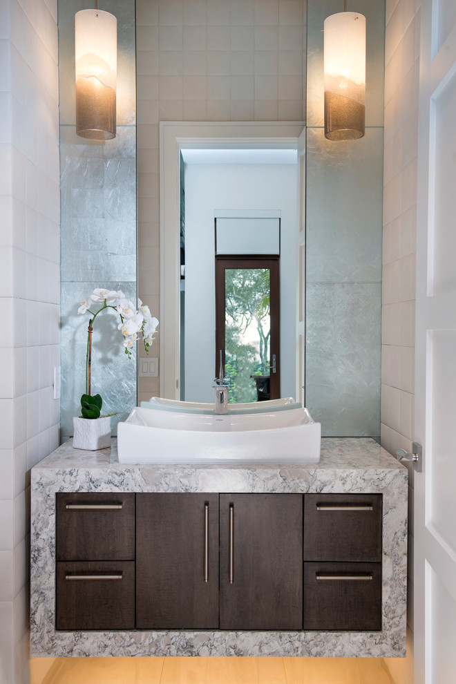 Design ideas for a contemporary powder room in Orlando with flat-panel cabinets, dark wood cabinets, white tile, subway tile, marble benchtops and white benchtops.