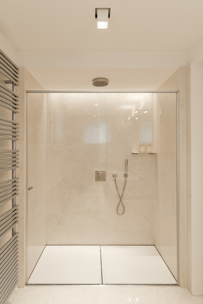 Photo of a contemporary bathroom in Baltimore with a curbless shower, beige tile and beige walls.