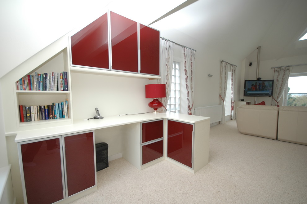 Small contemporary study room in Dorset with white walls and a built-in desk.