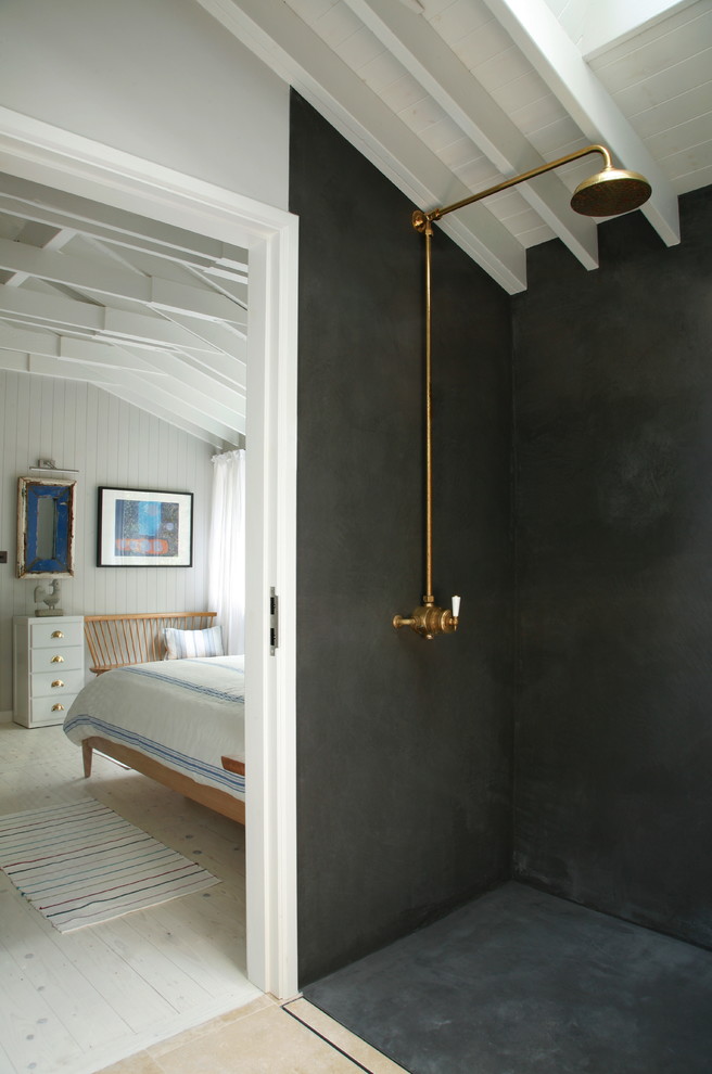 This is an example of a scandinavian bathroom in London with a freestanding tub, a vessel sink and grey walls.