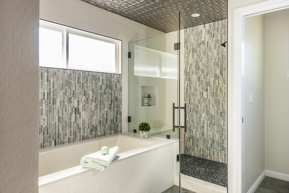 Photo of a large transitional master wet room bathroom in San Francisco with shaker cabinets, blue cabinets, an undermount tub, a two-piece toilet, green tile, slate, white walls, porcelain floors, an undermount sink, engineered quartz benchtops, green floor and a hinged shower door.
