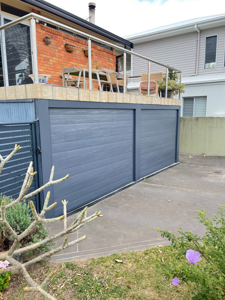 Design ideas for a small classic attached double garage in Newcastle - Maitland.