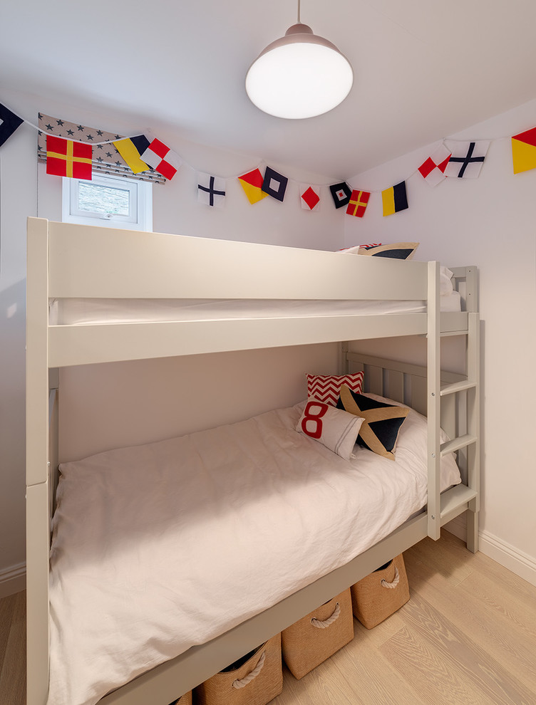 This is an example of a beach style kids' room in Devon.