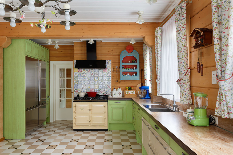 Photo of a large country l-shaped eat-in kitchen in Saint Petersburg with raised-panel cabinets, green cabinets, laminate benchtops, multi-coloured splashback, ceramic splashback, ceramic floors, no island, multi-coloured floor, beige benchtop, a drop-in sink and coloured appliances.