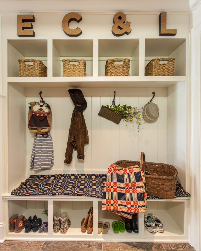 Photo of a country mudroom in Nashville with white walls.
