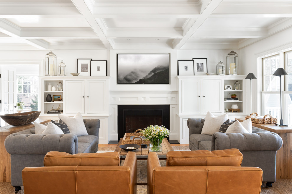 Photo of a transitional living room in Boston with white walls, medium hardwood floors, a standard fireplace, brown floor and coffered.