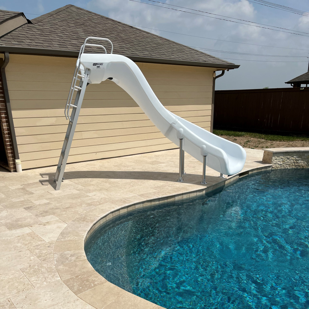 Example of a transitional stone and custom-shaped pool design in Houston
