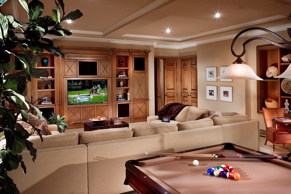 Inspiration for a mediterranean open concept family room in Orange County with a game room, beige walls and a built-in media wall.