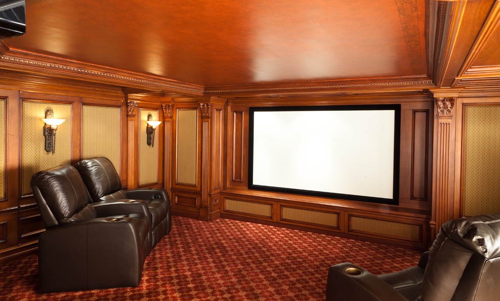 Photo of a mid-sized traditional enclosed home theatre in New York with brown walls, carpet, a wall-mounted tv and red floor.