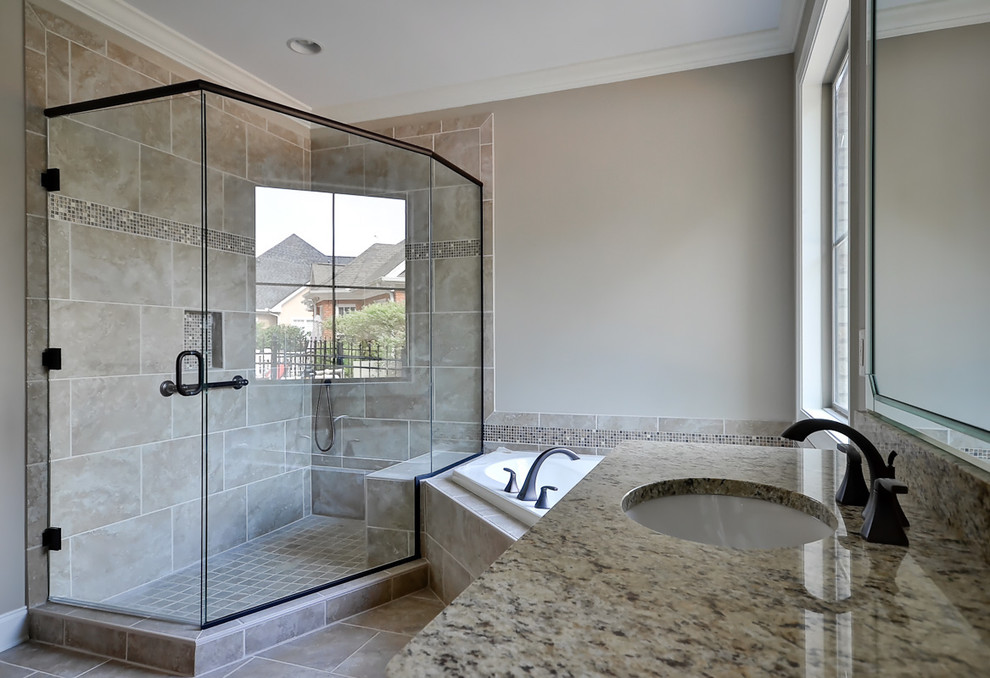 Photo of a large mediterranean master bathroom in Other with an undermount sink, beaded inset cabinets, distressed cabinets, granite benchtops, a corner tub, a corner shower, brown tile, porcelain tile, beige walls and porcelain floors.