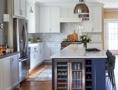 Open concept family kitchen with large island and multiple seating areas