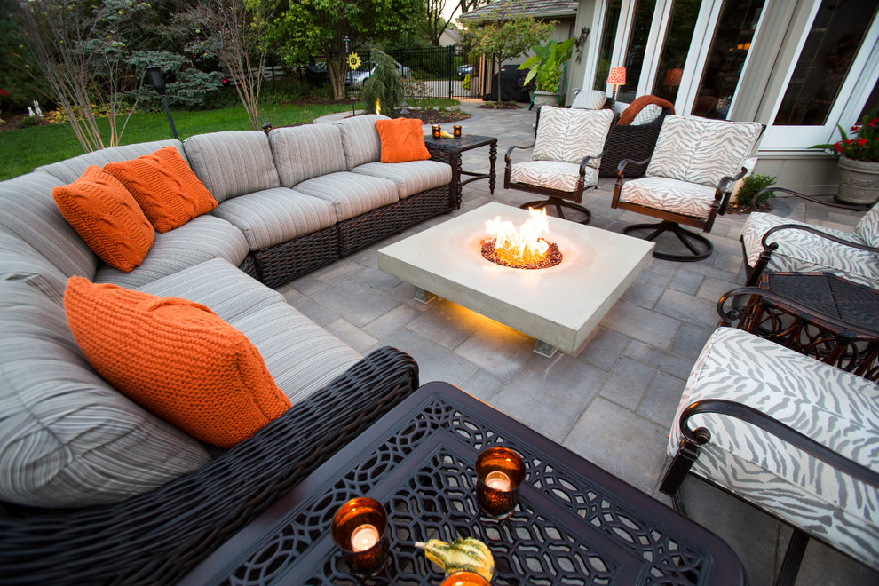 Design ideas for a transitional backyard stone water fountain landscape in Omaha.