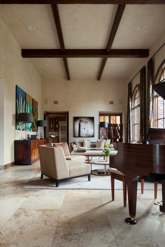 This is an example of a mediterranean living room in Austin with a music area and beige walls.