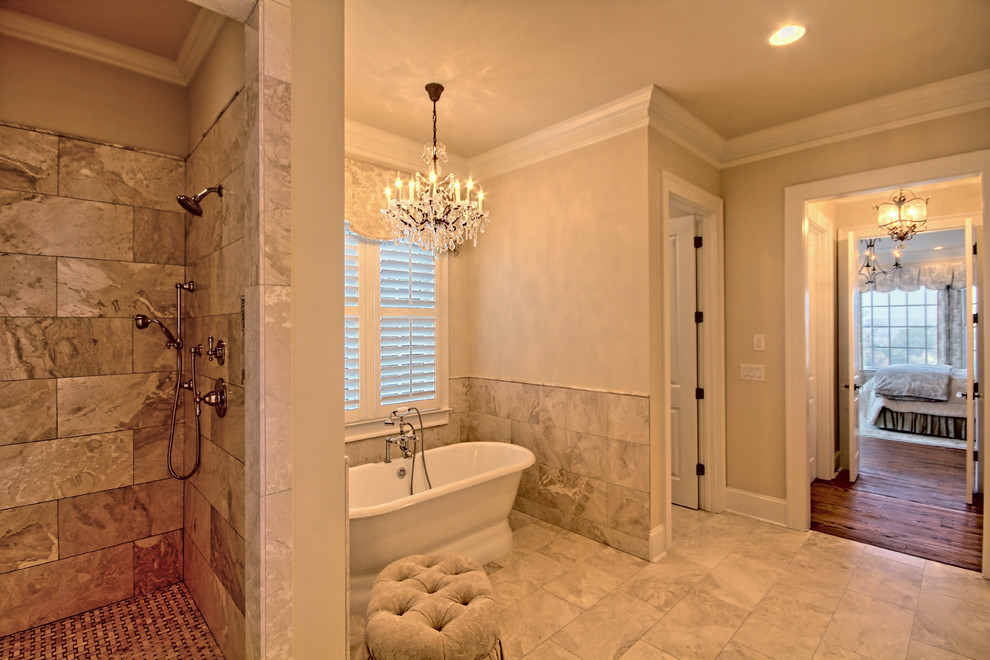 Photo of a large traditional master bathroom in Atlanta with recessed-panel cabinets, distressed cabinets, a freestanding tub, porcelain tile, beige walls, porcelain floors, an undermount sink, marble benchtops and an open shower.