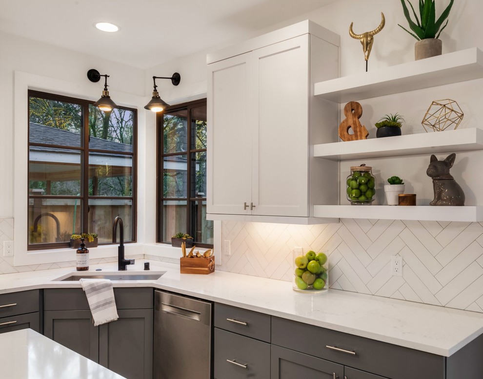 Inspiration for a large transitional l-shaped light wood floor and brown floor eat-in kitchen remodel in Seattle with an undermount sink, shaker cabinets, gray cabinets, granite countertops, white backsplash, porcelain backsplash, stainless steel appliances, an island and white countertops