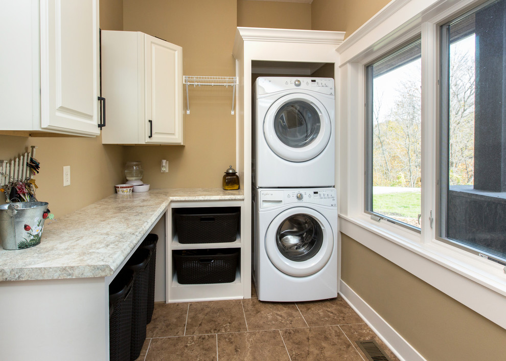 Inspiration for a transitional laundry room remodel in Cedar Rapids