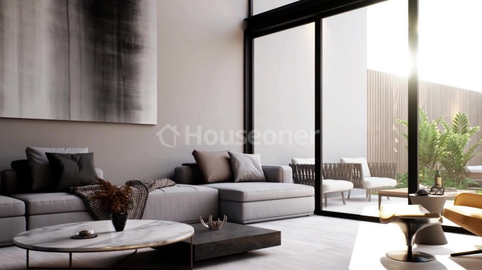 Großes, Offenes Modernes Wohnzimmer mit Hausbar, grauer Wandfarbe, Bambusparkett, Eckkamin, Kaminumrandung aus Beton, TV-Wand und grauem Boden in Valencia