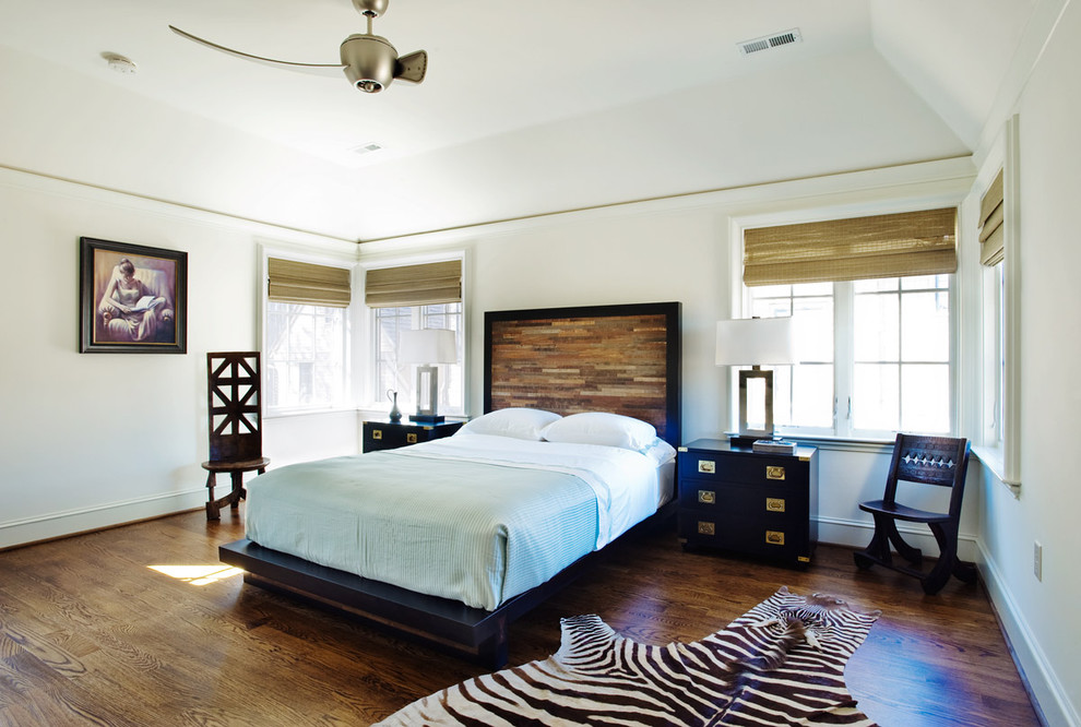 Inspiration for a large eclectic guest bedroom in Other with white walls, dark hardwood floors and brown floor.
