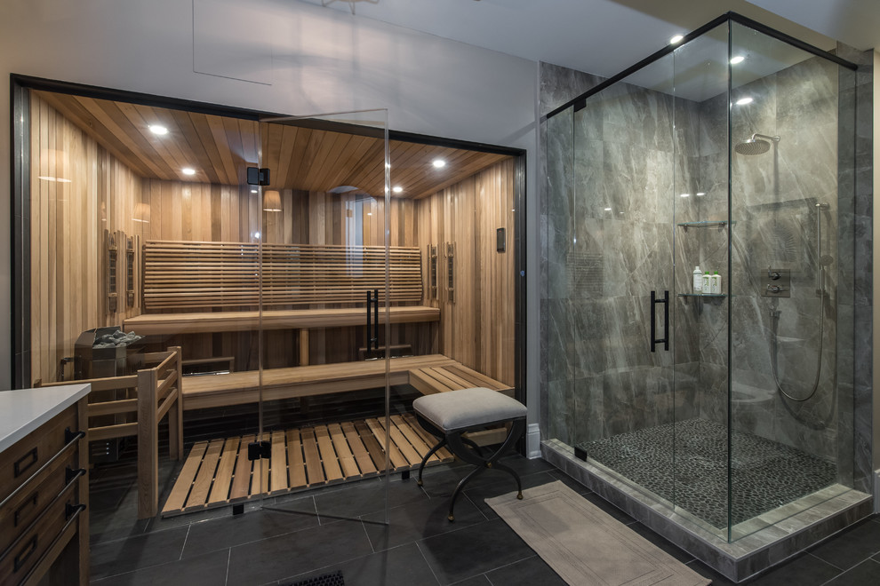 Inspiration for a large traditional bathroom in Other with a corner shower, gray tile, marble, grey walls, slate floors, with a sauna, granite benchtops, grey floor, a hinged shower door, white benchtops, flat-panel cabinets and medium wood cabinets.