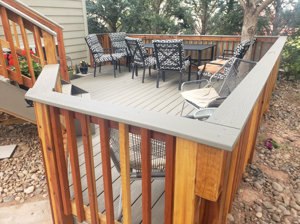 Mid-sized minimalist backyard second story wood railing deck photo in Denver
