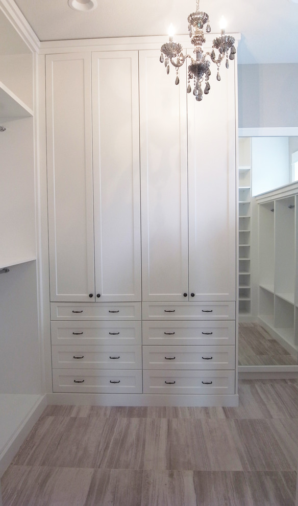 Walk-in closet - transitional women's walk-in closet idea with white cabinets and flat-panel cabinets