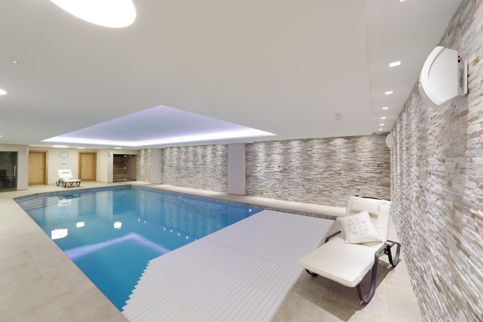 This is an example of a contemporary indoor rectangular pool in Kent.