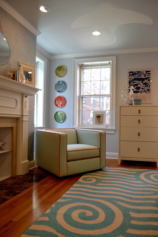This is an example of a mid-sized transitional kids' room for girls in Boston with medium hardwood floors and grey walls.