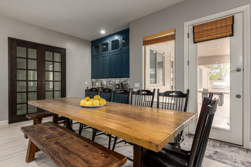 Huge mountain style l-shaped dining room photo in Phoenix with shaker cabinets, blue cabinets, wood countertops, multicolored backsplash, metal backsplash and brown countertops