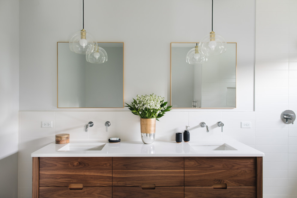 Inspiration for a contemporary bathroom in Chicago with flat-panel cabinets, medium wood cabinets, white tile, white walls, an undermount sink, an open shower and white benchtops.