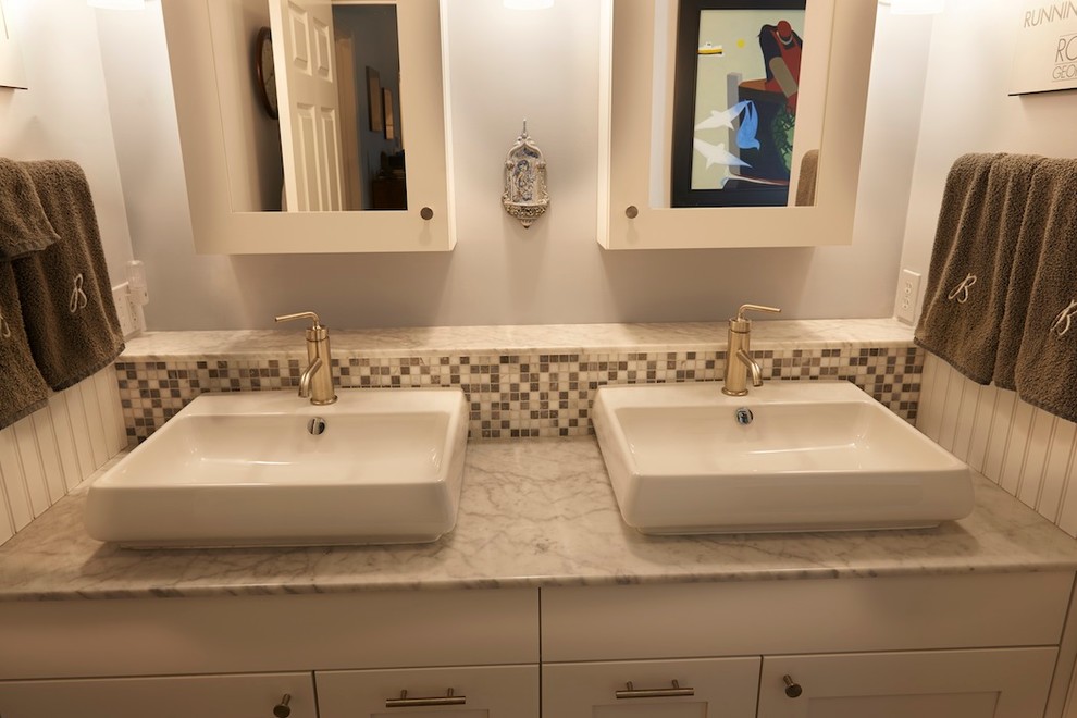 Mid-sized transitional master bathroom in Bridgeport with shaker cabinets, white cabinets, a freestanding tub, an alcove shower, mosaic tile, white walls, ceramic floors, a vessel sink and marble benchtops.