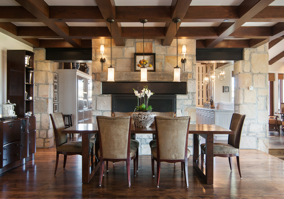 Design ideas for a country dining room in Salt Lake City with dark hardwood floors and a standard fireplace.