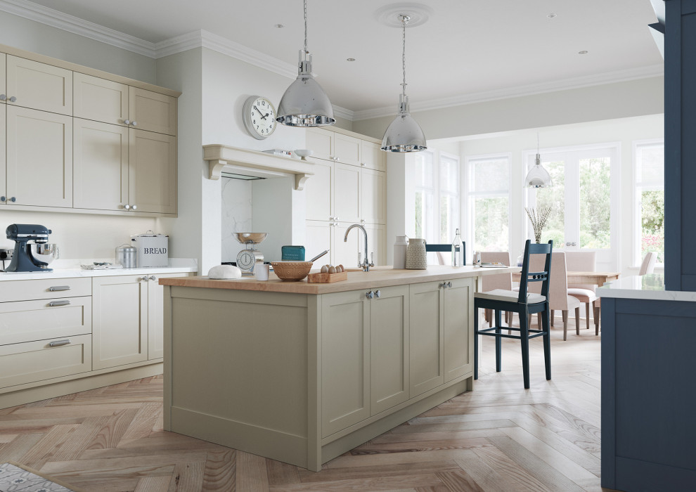 This is an example of a large contemporary galley eat-in kitchen in Cheshire with an undermount sink, shaker cabinets, beige cabinets, wood benchtops, white splashback, engineered quartz splashback, coloured appliances, medium hardwood floors, with island, brown floor and brown benchtop.