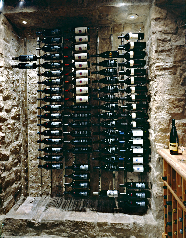Mid-sized transitional porcelain tile and black floor wine cellar photo in Phoenix with display racks