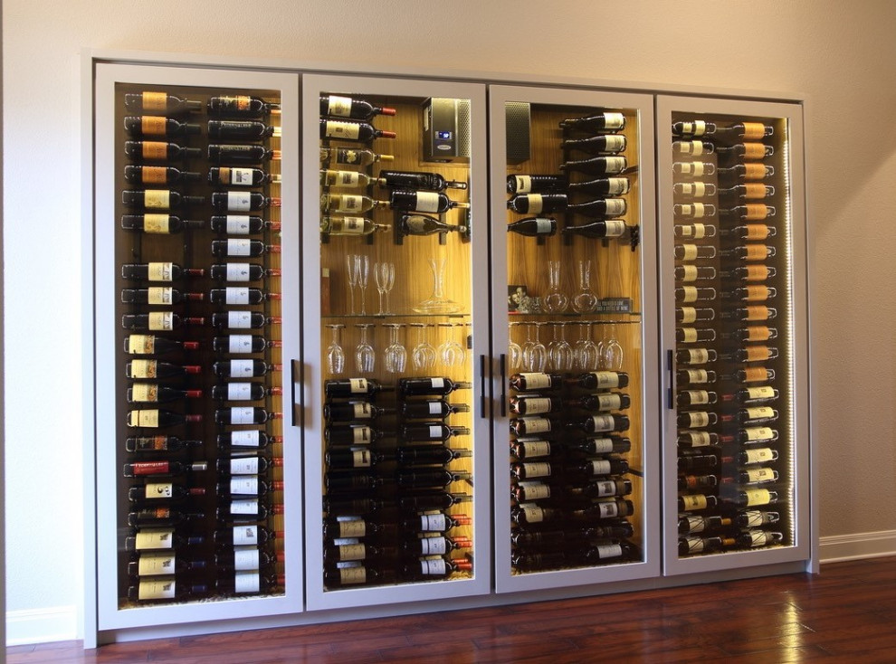 Mid-sized contemporary wine cellar in Austin with display racks.