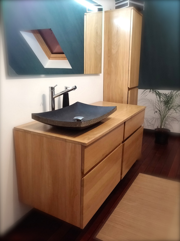 Photo of a mid-sized contemporary bathroom in Other with a vessel sink.