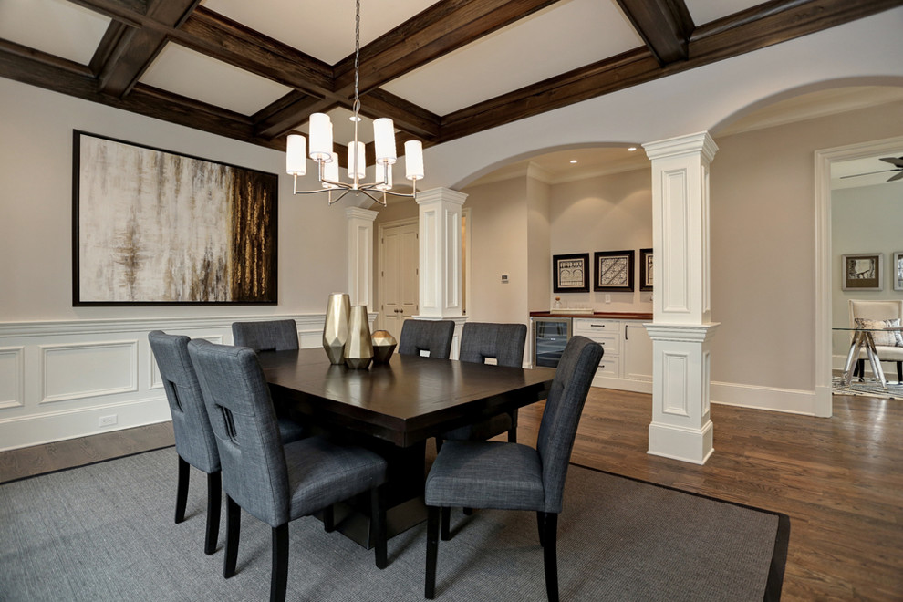 Transitional separate dining room in Atlanta with beige walls, dark hardwood floors and brown floor.