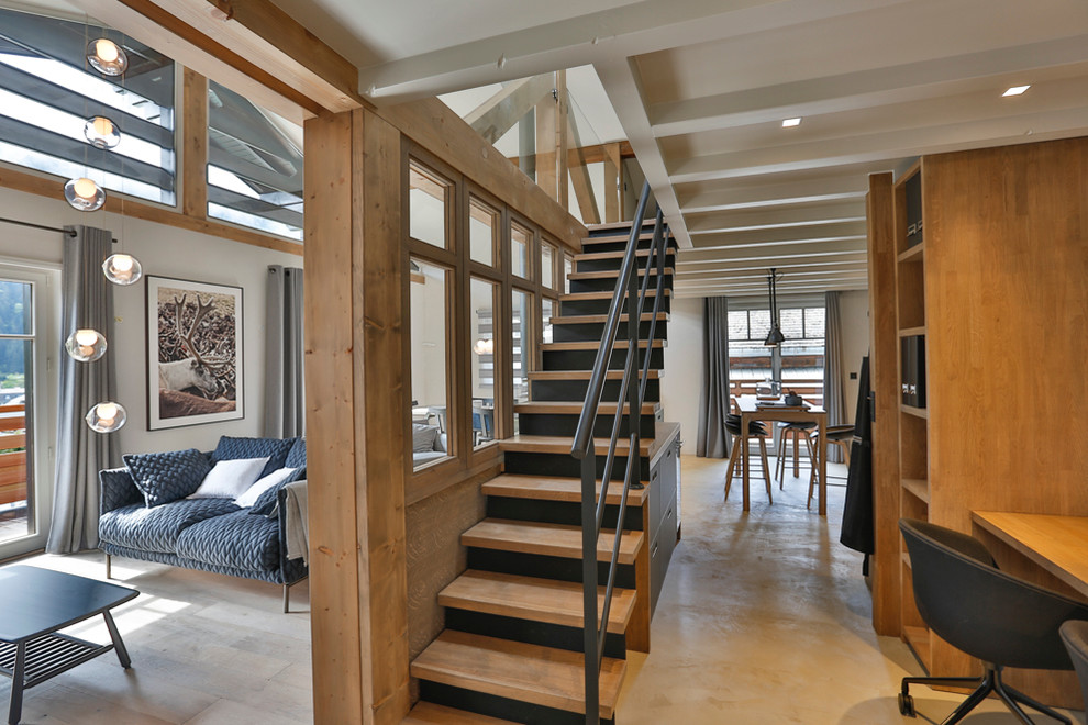 Design ideas for a mid-sized contemporary wood straight staircase in Lyon with metal risers.