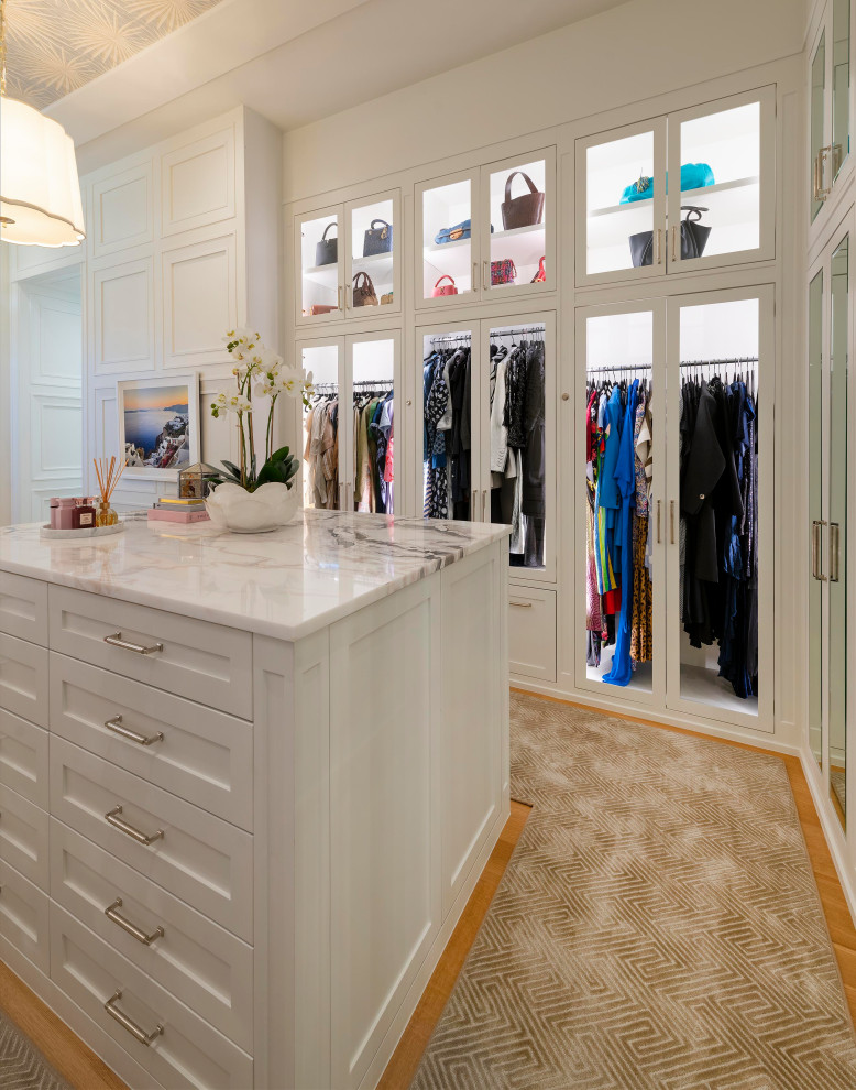 Walk-in closet - large transitional gender-neutral carpeted, beige floor and wallpaper ceiling walk-in closet idea in Dallas with shaker cabinets and white cabinets