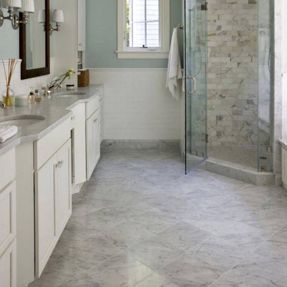 Corner shower - large transitional master gray tile, multicolored tile, white tile and marble tile marble floor and multicolored floor corner shower idea with recessed-panel cabinets, white cabinets, multicolored walls, an undermount sink, marble countertops and a hinged shower door