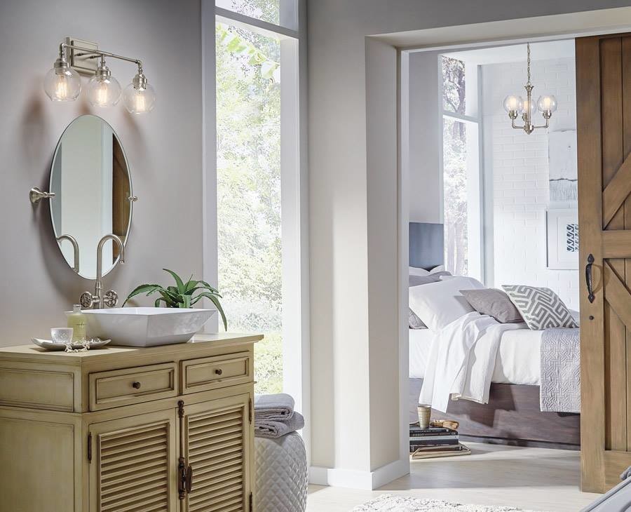 Mountain style 3/4 light wood floor and beige floor bathroom photo with furniture-like cabinets, light wood cabinets, beige walls, a vessel sink and wood countertops